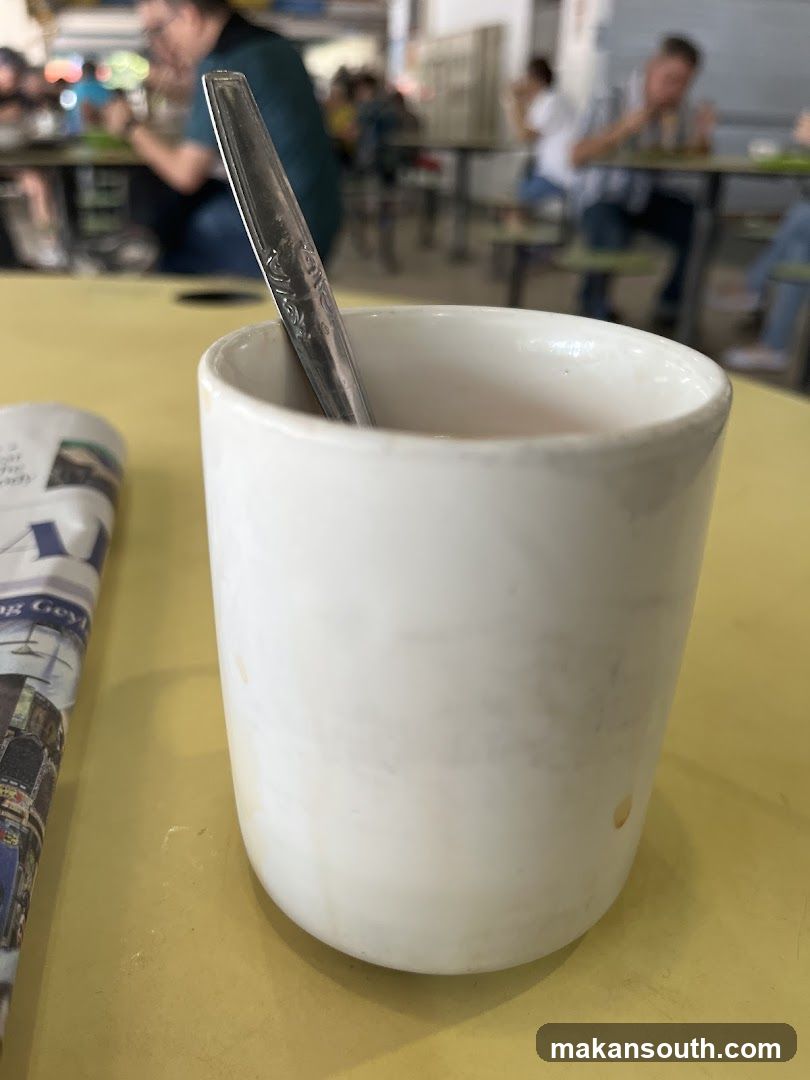 Cup with Spoon and Newspaper