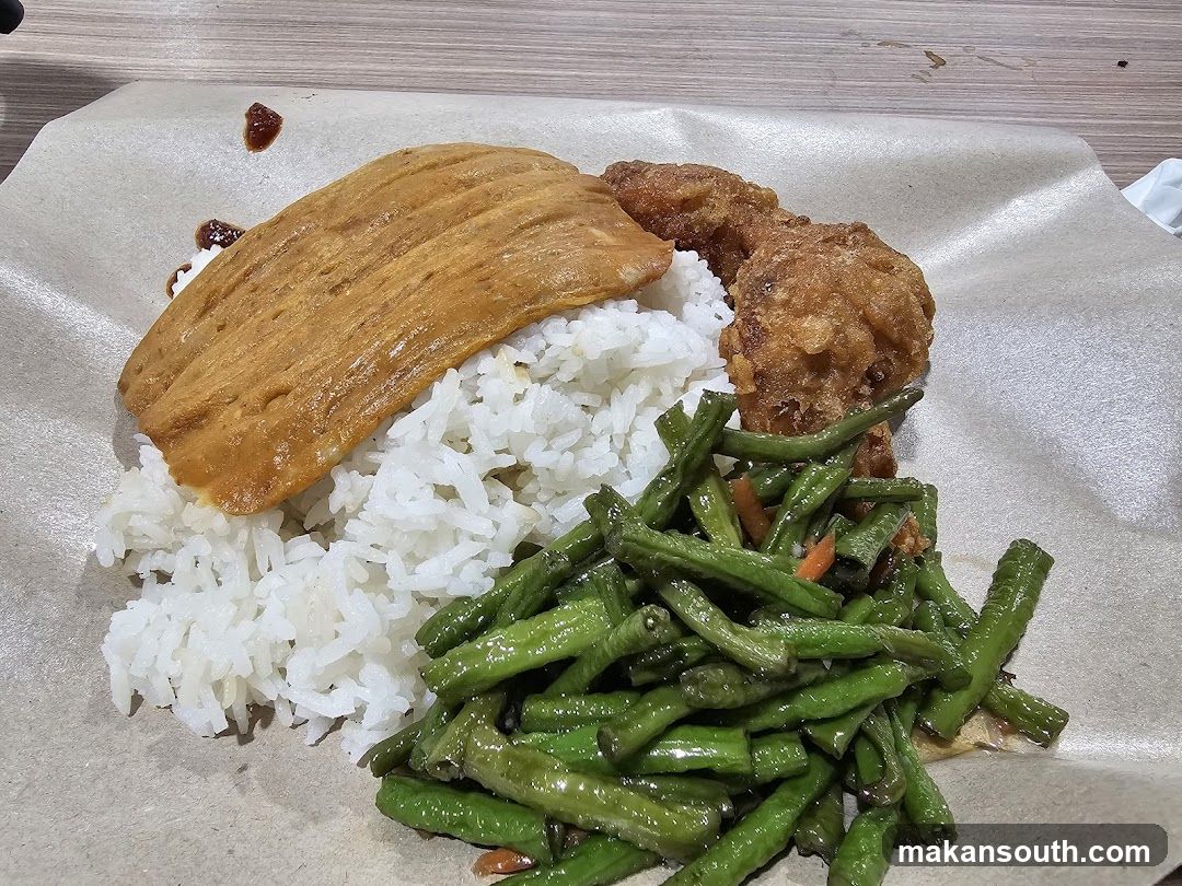 Rice plate with fried chicken and vegetables