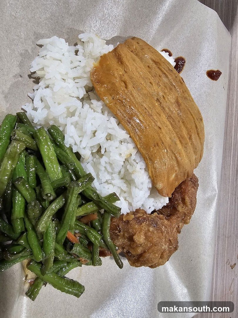 Rice plate with fried chicken and vegetables