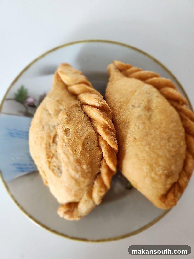 Two Curry Puffs on a Plate