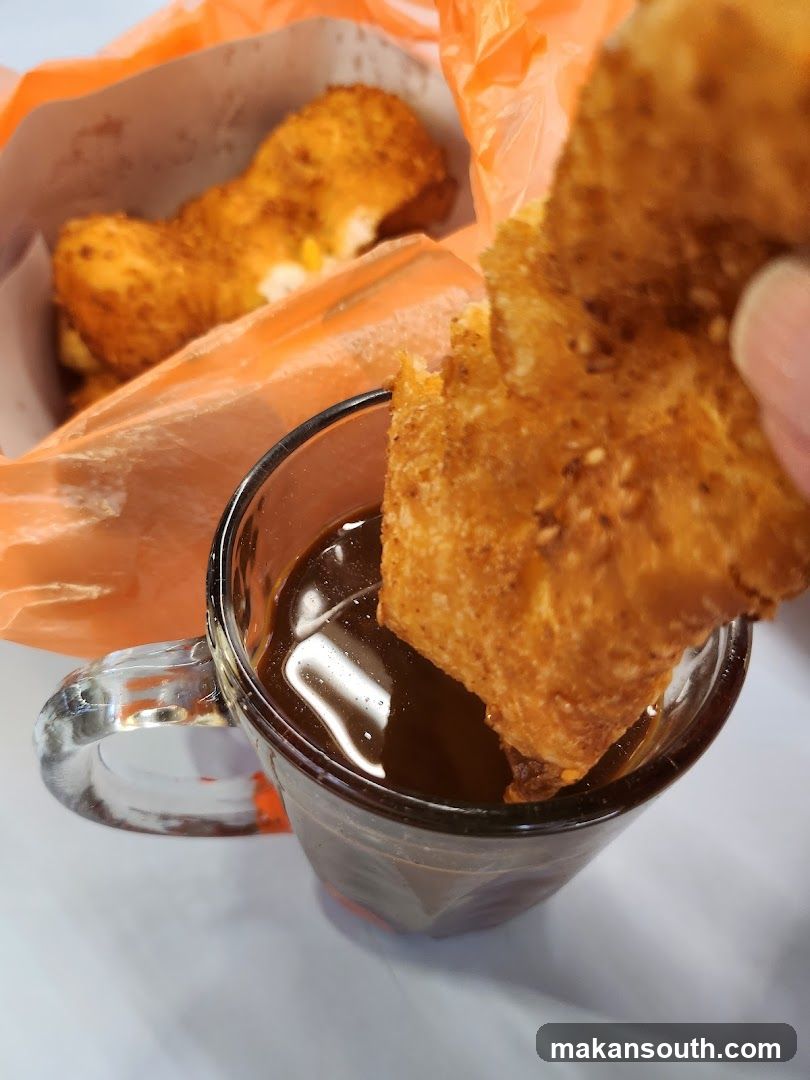Fried Snack Dipped in Coffee