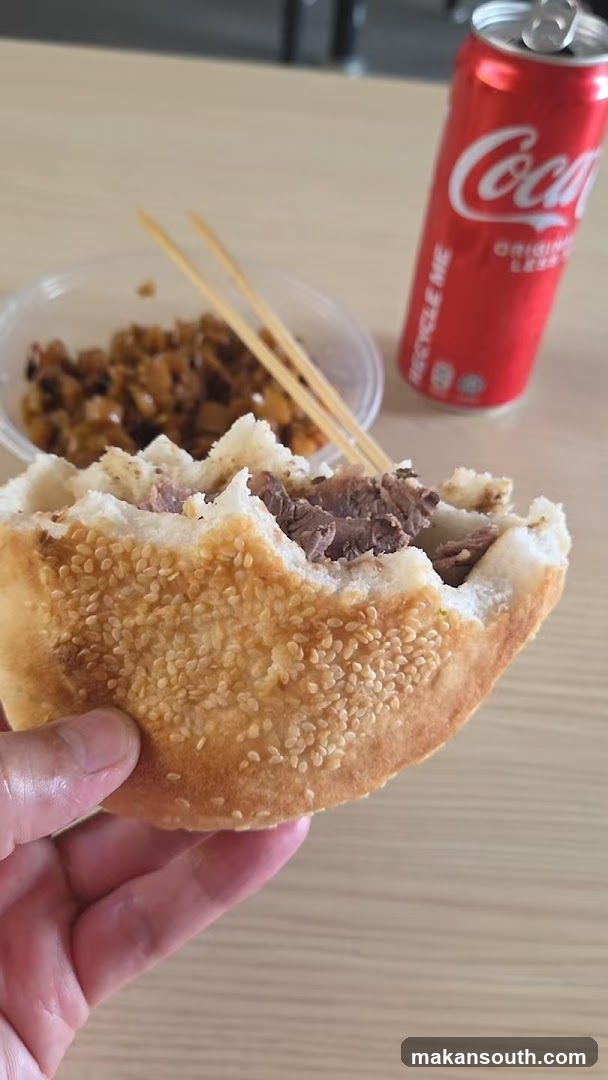 Sesame Seed Bun with Meat Filling and Coca-Cola