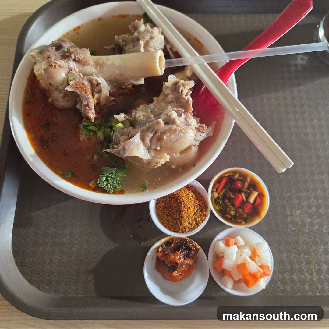 Bowl of Soup with Meat and Sides