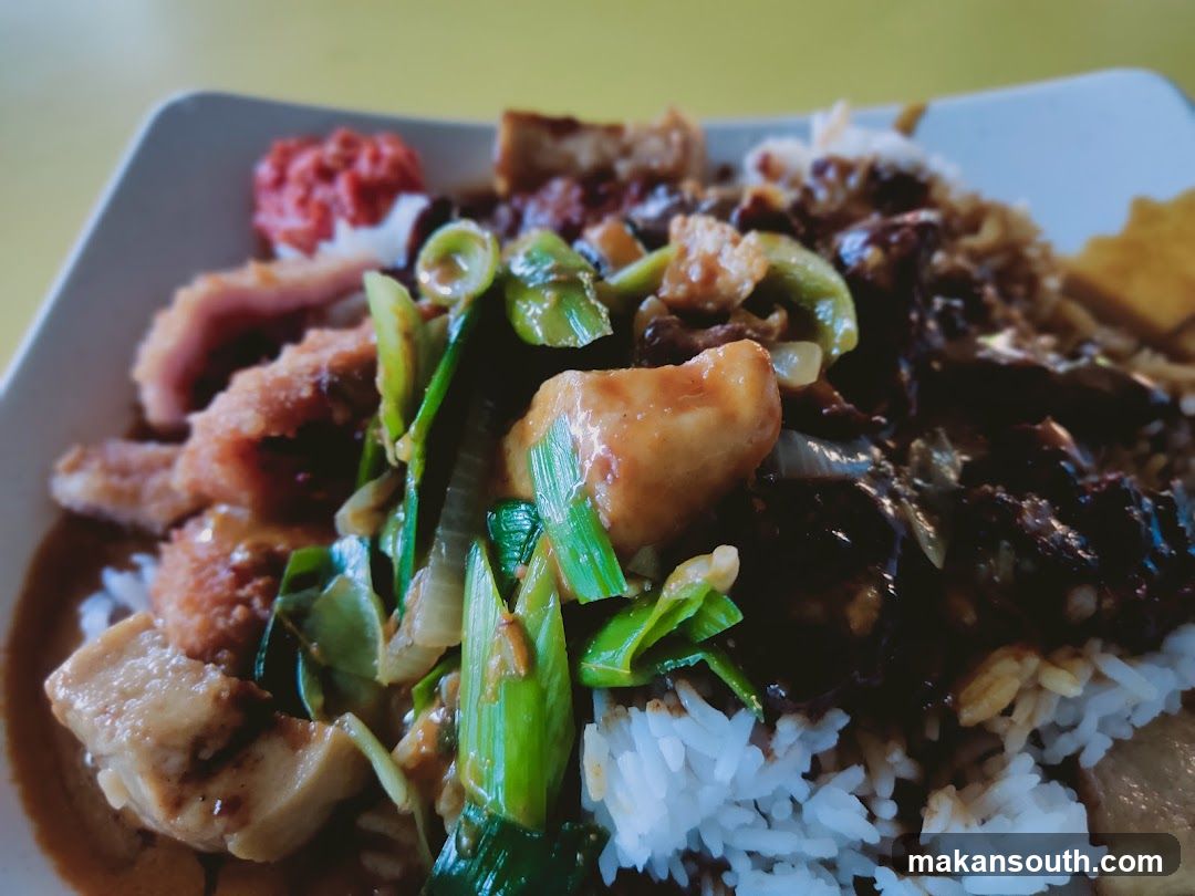 Plate of food with rice and stir-fried ingredients