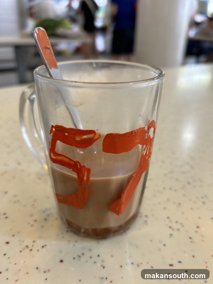 Mug with drink and spoon