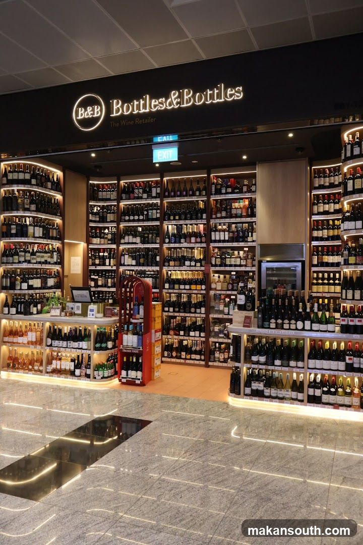 A well-lit wine shop with extensive displays of wine bottles on shelves. The shop's name, "Bottles & Bottles The Wine Retailer," is prominently displayed above the entrance. An "EXIT" sign is visible.