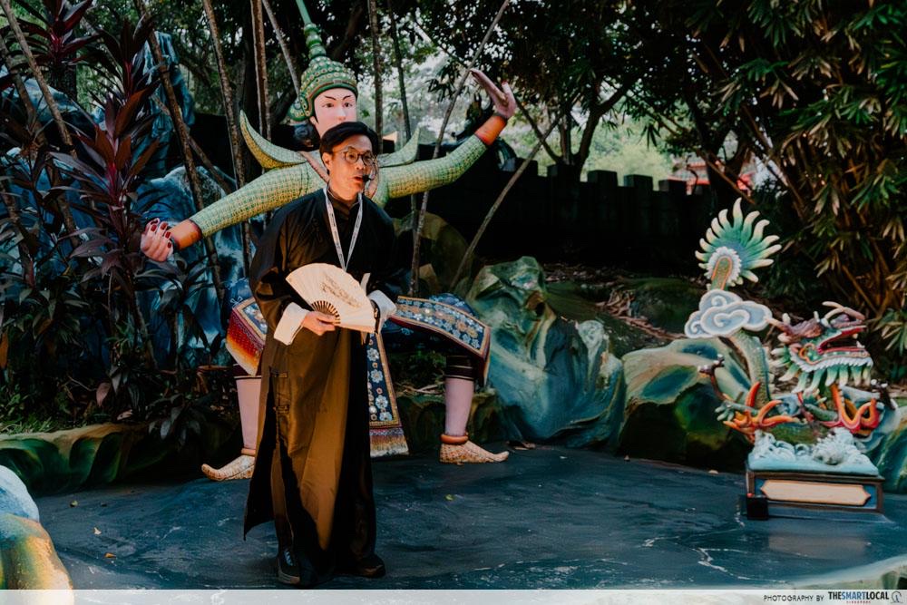A court official from Haw Ror Villa 5 greets visitors at Haw Par Villa