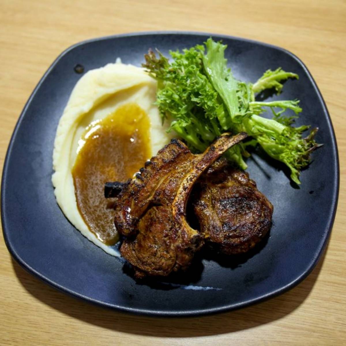 A fire-grilled steak from a hawker-style stall, the style of smoky grilled dish served at the Local Grills zone of Sentosa GrillFest 2026 on Siloso Beach