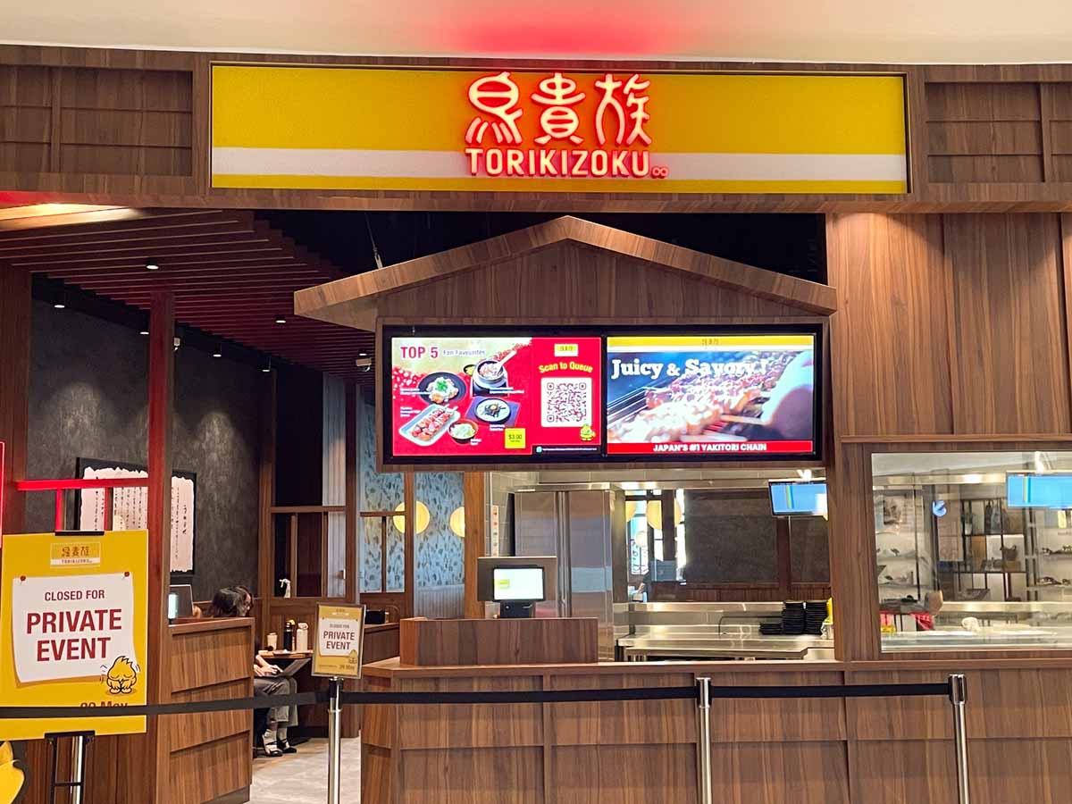 Storefront of Torikizoku at VivoCity, with the brand's signature yellow signboard marking the first Singapore outlet of the Japanese yakitori chain