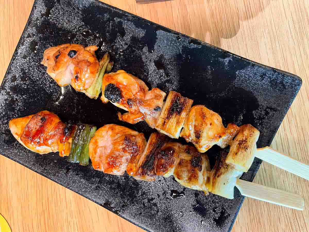 Signature Kizokuyaki chicken thigh yakitori skewer with leek and tare sauce, the headline order at Torikizoku VivoCity Singapore